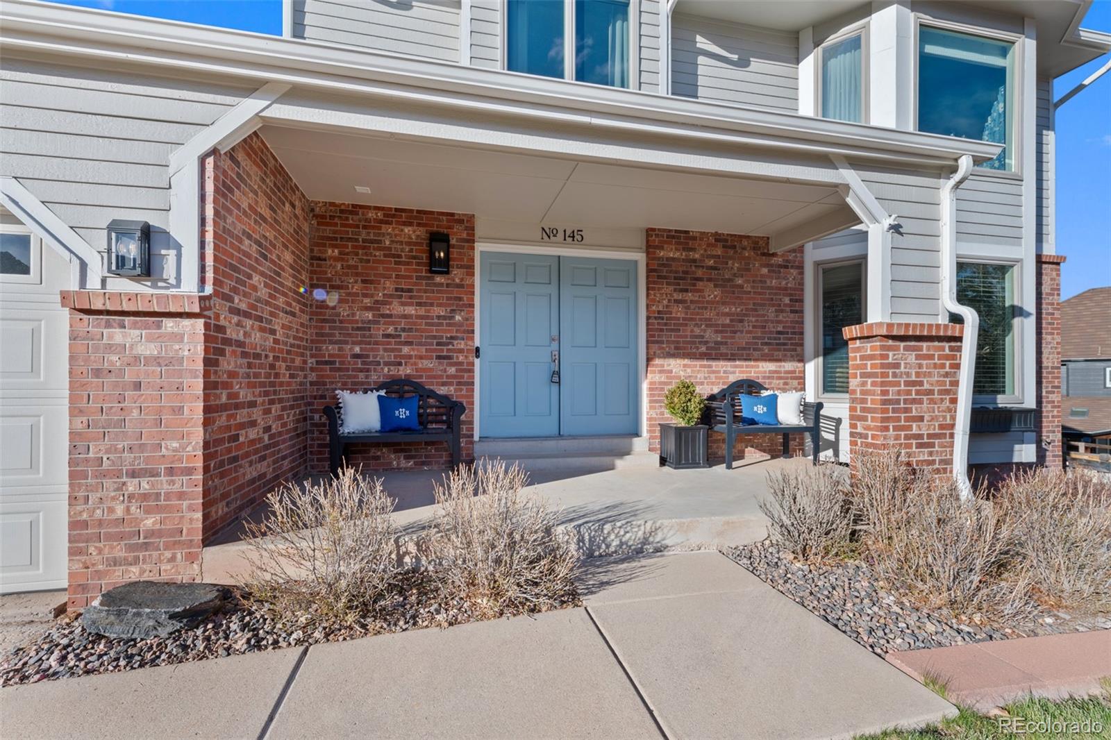 145 Willowleaf Drive Littleton, CO 80127 - Photo 3 of 42 a front view of a house with garden
