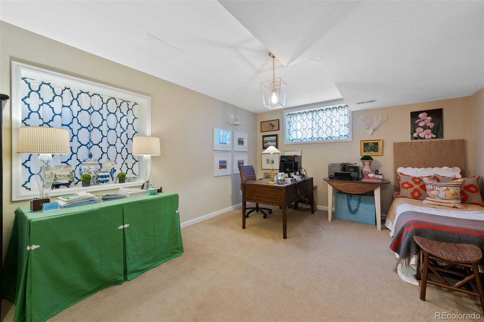 145 Willowleaf Drive Littleton, CO 80127 - Photo 33 of 42 a bedroom with furniture and a window