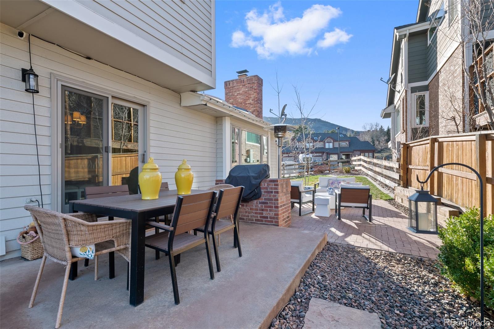145 Willowleaf Drive Littleton, CO 80127 - Photo 39 of 42 a view of a dinning table and chairs in the patio