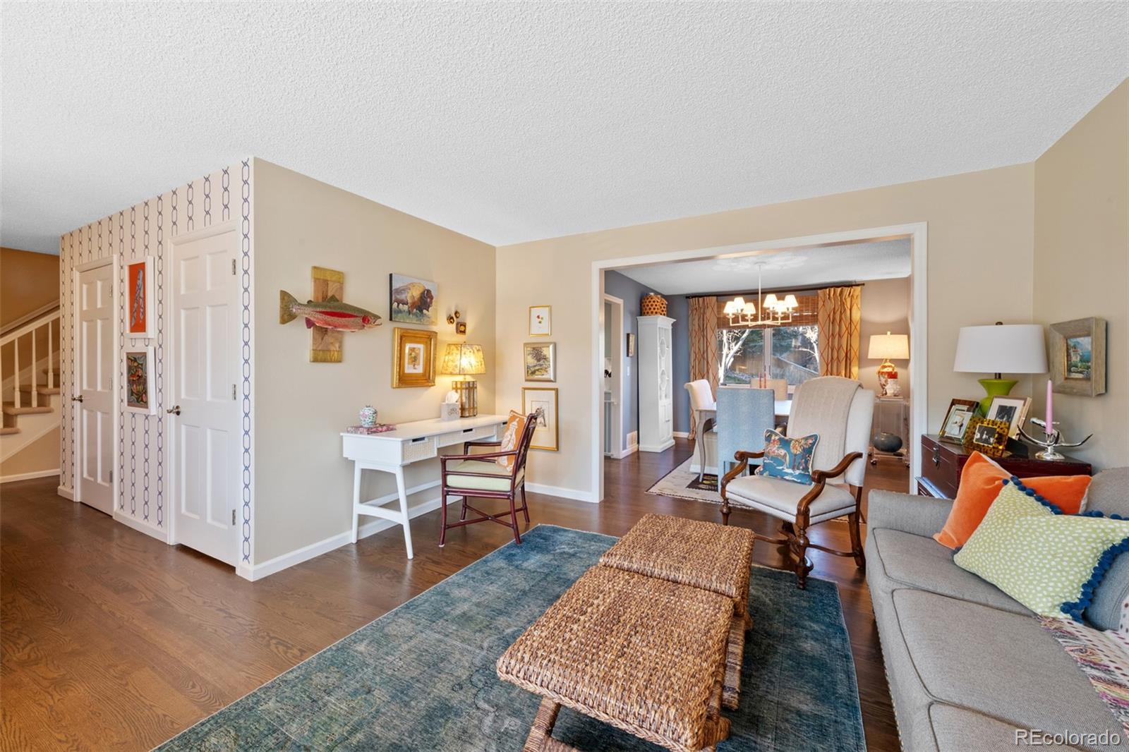 145 Willowleaf Drive Littleton, CO 80127 - Photo 9 of 42 a living room with furniture wooden floor and a table