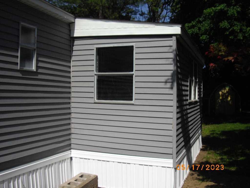 198 Sinpatch Road Amenia, NY 12592 - Photo 6 of 27 a view of a house with a door and a tree