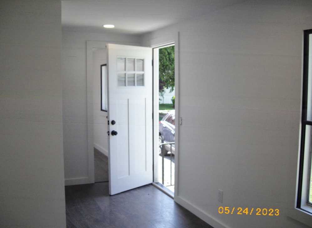 198 Sinpatch Road Amenia, NY 12592 - Photo 7 of 27 an empty room with wooden floor and a window