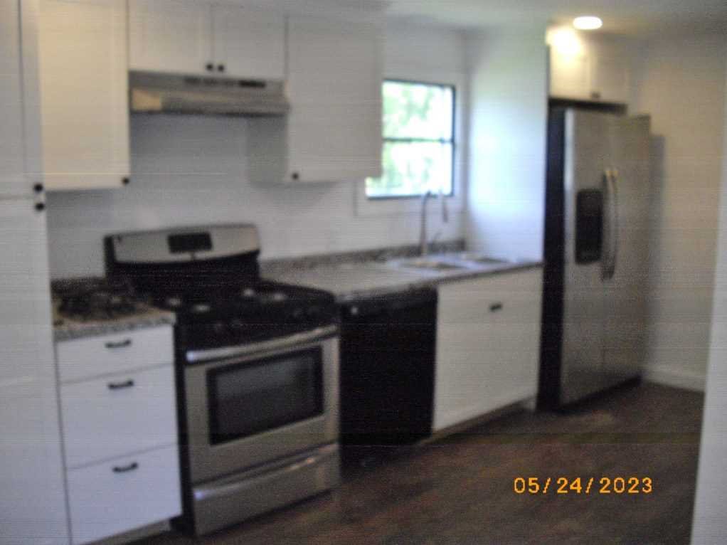 198 Sinpatch Road Amenia, NY 12592 - Photo 8 of 27 a kitchen with stainless steel appliances granite countertop a stove a refrigerator and a sink