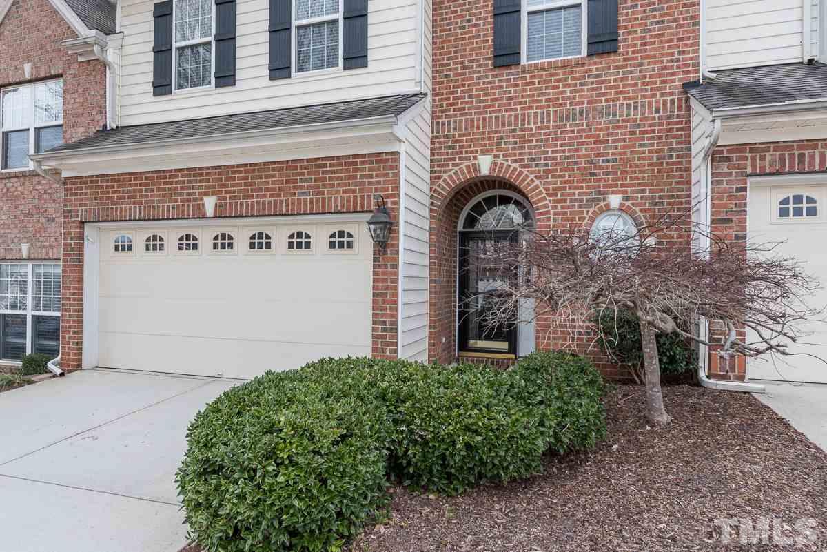 12227 Orchardgrass Lane Raleigh, NC 27614 - Photo 2 of 25 a front view of a building with garden