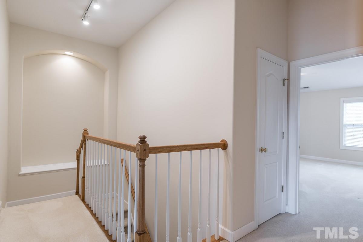 12227 Orchardgrass Lane Raleigh, NC 27614 - Photo 14 of 25 a view of a hallway with a white door