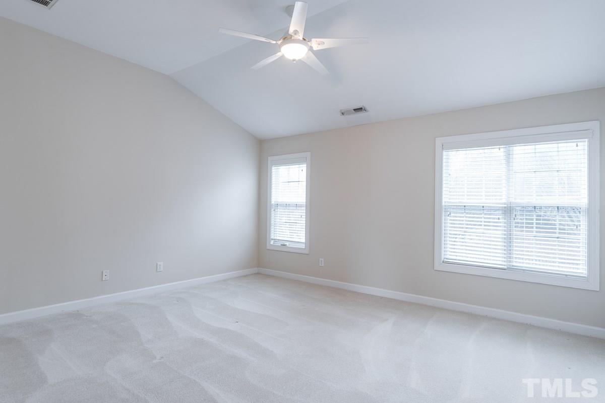 12227 Orchardgrass Lane Raleigh, NC 27614 - Photo 15 of 25 a view of empty room with window and ceiling fan