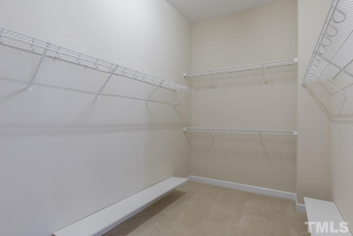 12227 Orchardgrass Lane Raleigh, NC 27614 - Photo 19 of 25 a view of a room with racks on the wall