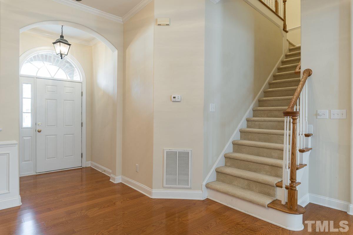 12227 Orchardgrass Lane Raleigh, NC 27614 - Photo 3 of 25 a view of an entryway with staircase
