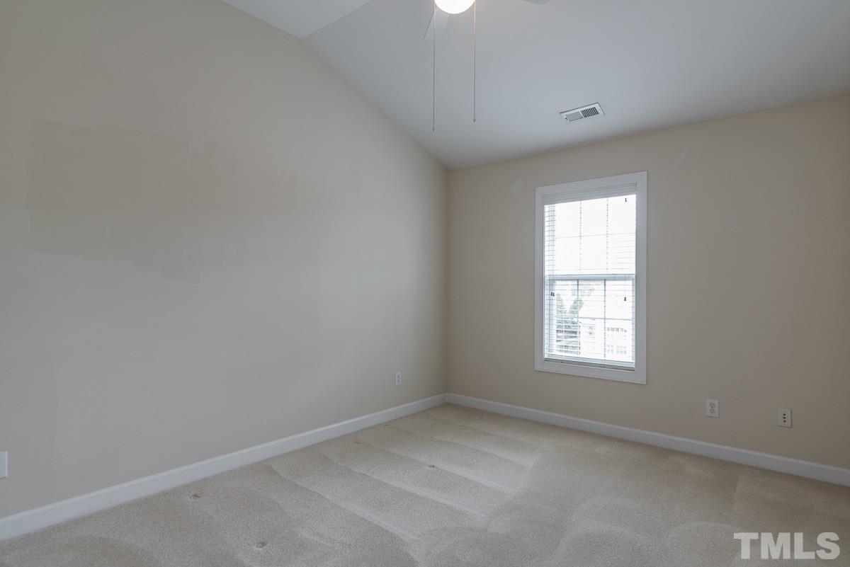 12227 Orchardgrass Lane Raleigh, NC 27614 - Photo 21 of 25 an empty room with a window