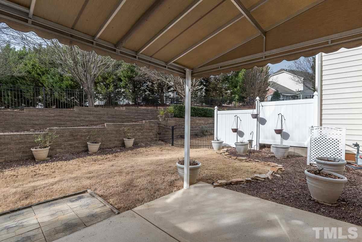 12227 Orchardgrass Lane Raleigh, NC 27614 - Photo 23 of 25 a outdoor space with lots of potted plants