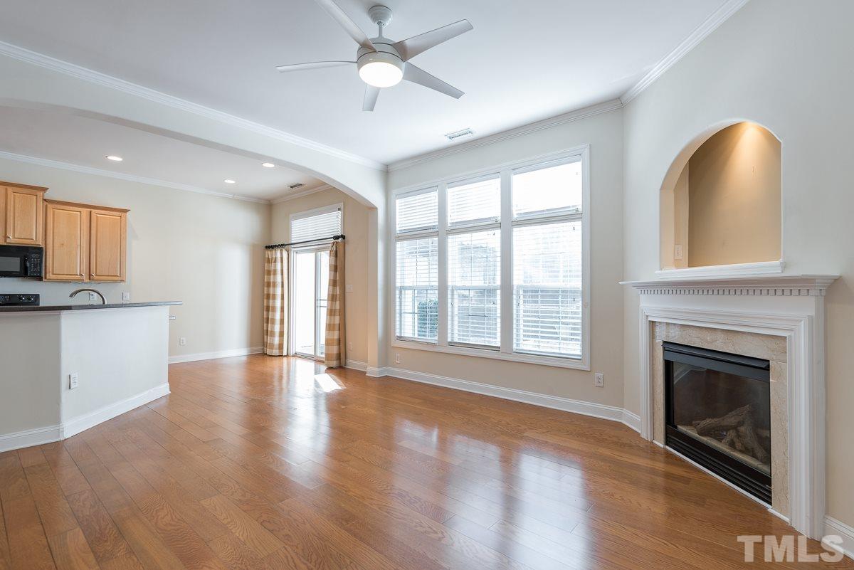 12227 Orchardgrass Lane Raleigh, NC 27614 - Photo 7 of 25 a view of an empty room with a fireplace and a window