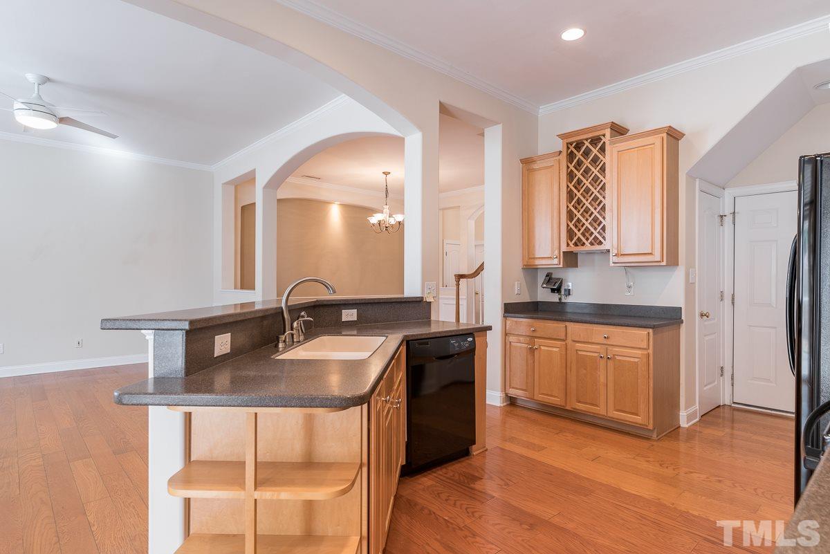 12227 Orchardgrass Lane Raleigh, NC 27614 - Photo 9 of 25 a bathroom with a granite countertop sink and a mirror