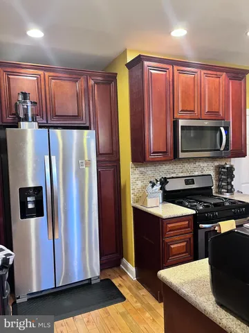 a view of a dining room with furniture and a window