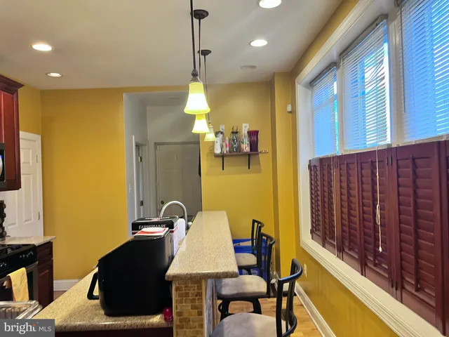 a bedroom with a bed and a lamp