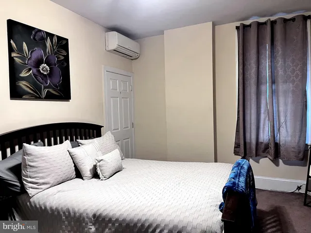 a view of a hallway with washer and dryer