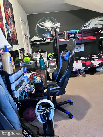 a view of a workspace with furniture