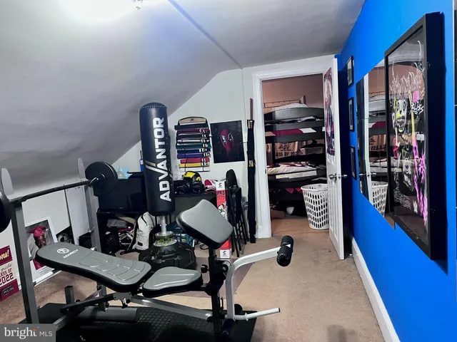 a car parked in front of a white house