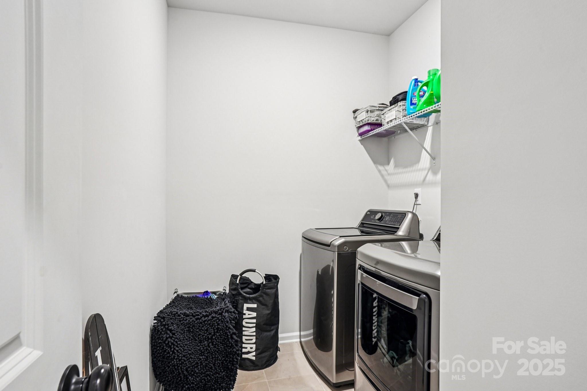 7914 Nelson Road Mint Hill, NC 28227 - Photo 14 of 25 a utility room with dryer and washer