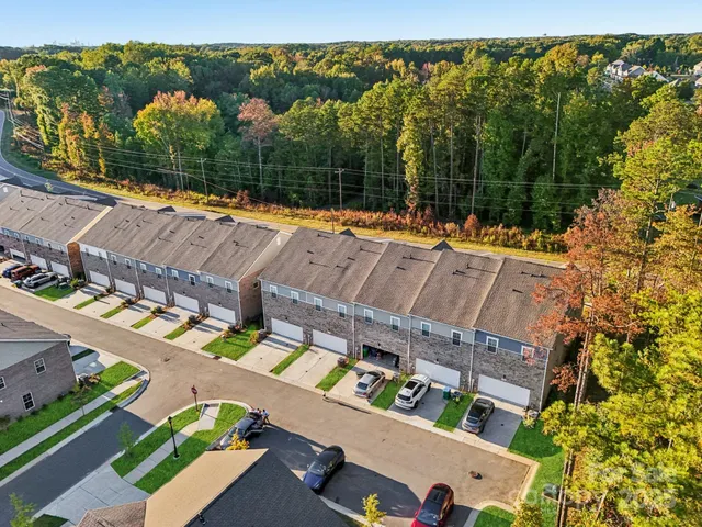 an outdoor sitting area with a lake view