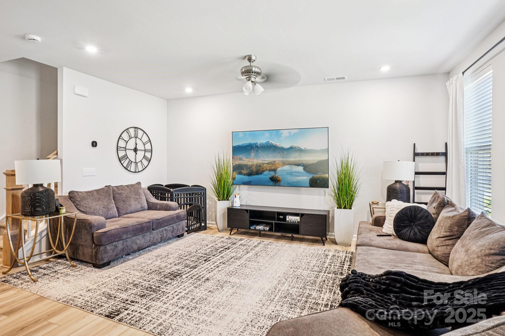 7914 Nelson Road Mint Hill, NC 28227 - Photo 5 of 25 a living room with furniture and a flat screen tv