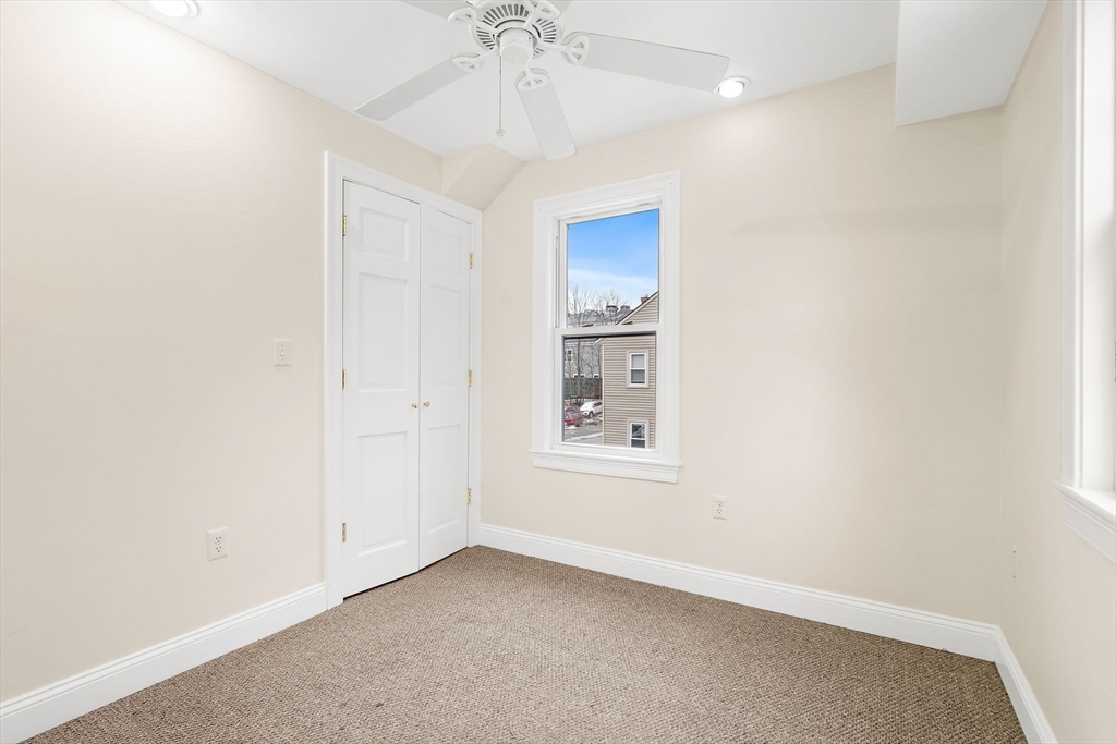 35 Water Street, Unit 35 Concord, MA 01742 - Photo 13 of 20 an empty room with windows and fan
