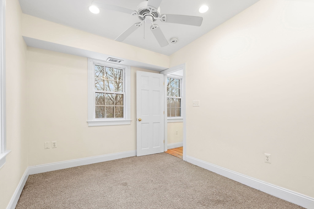 35 Water Street, Unit 35 Concord, MA 01742 - Photo 10 of 20 an empty room with windows and fan
