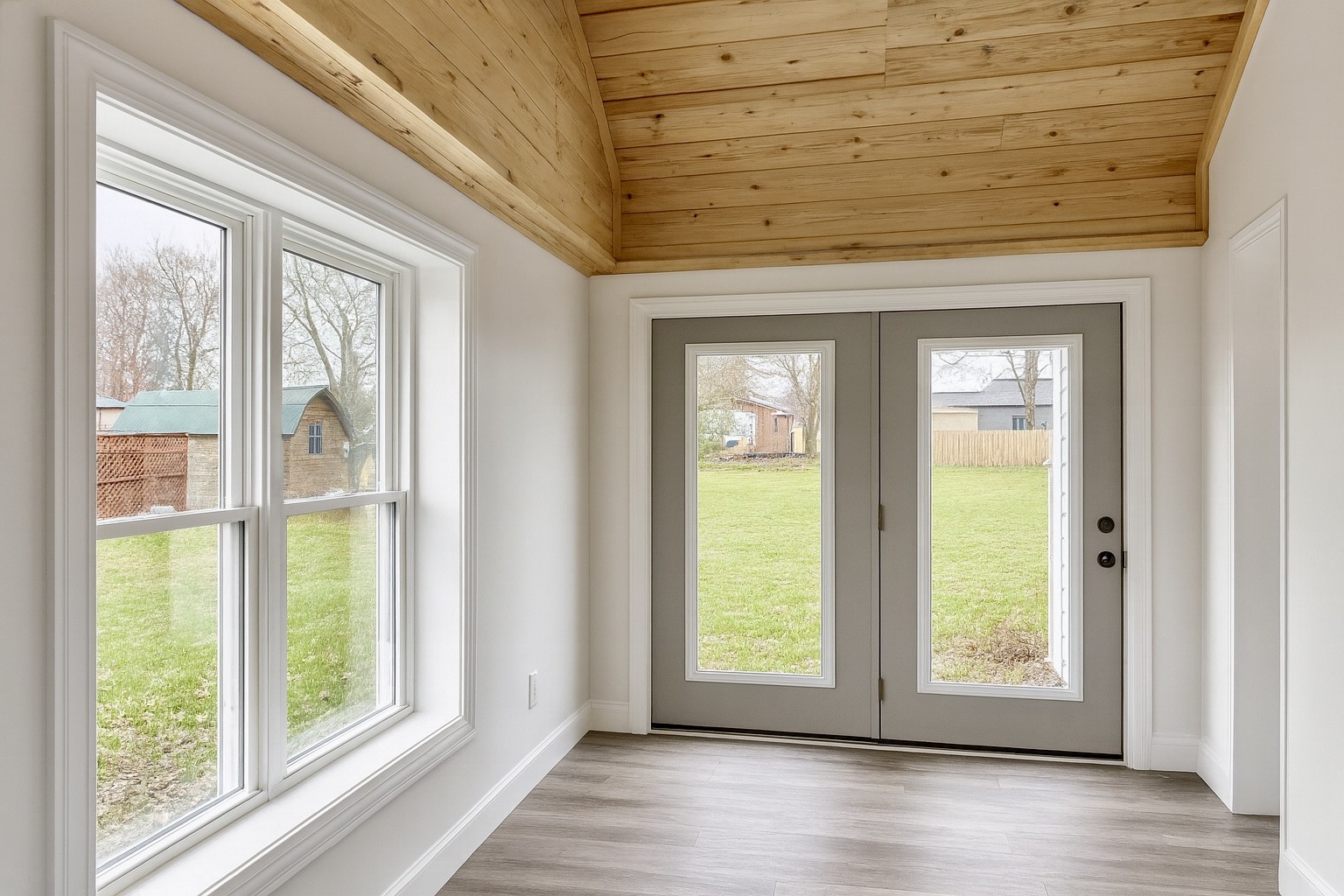 206 West Main Street Hohenwald, TN 38462 - Photo 12 of 24 a view of an empty room with wooden floor and a window