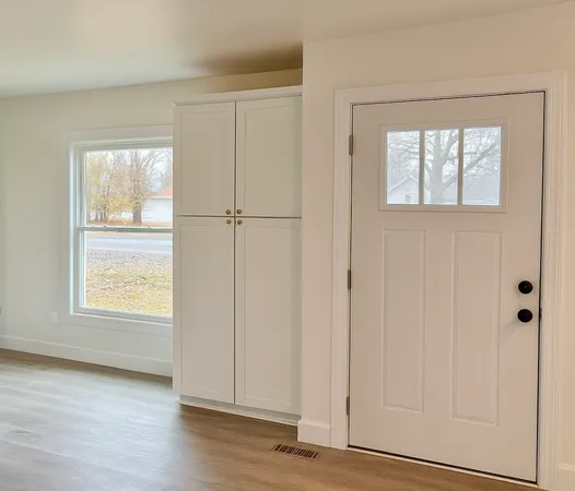 a view of entryway with wooden floor
