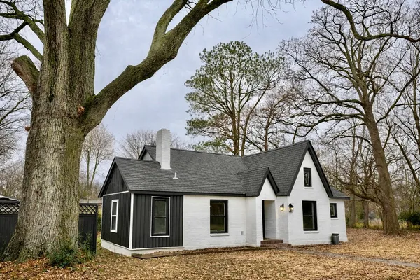 a house with trees in the background