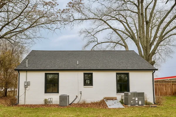 a house that has a tree in front of it