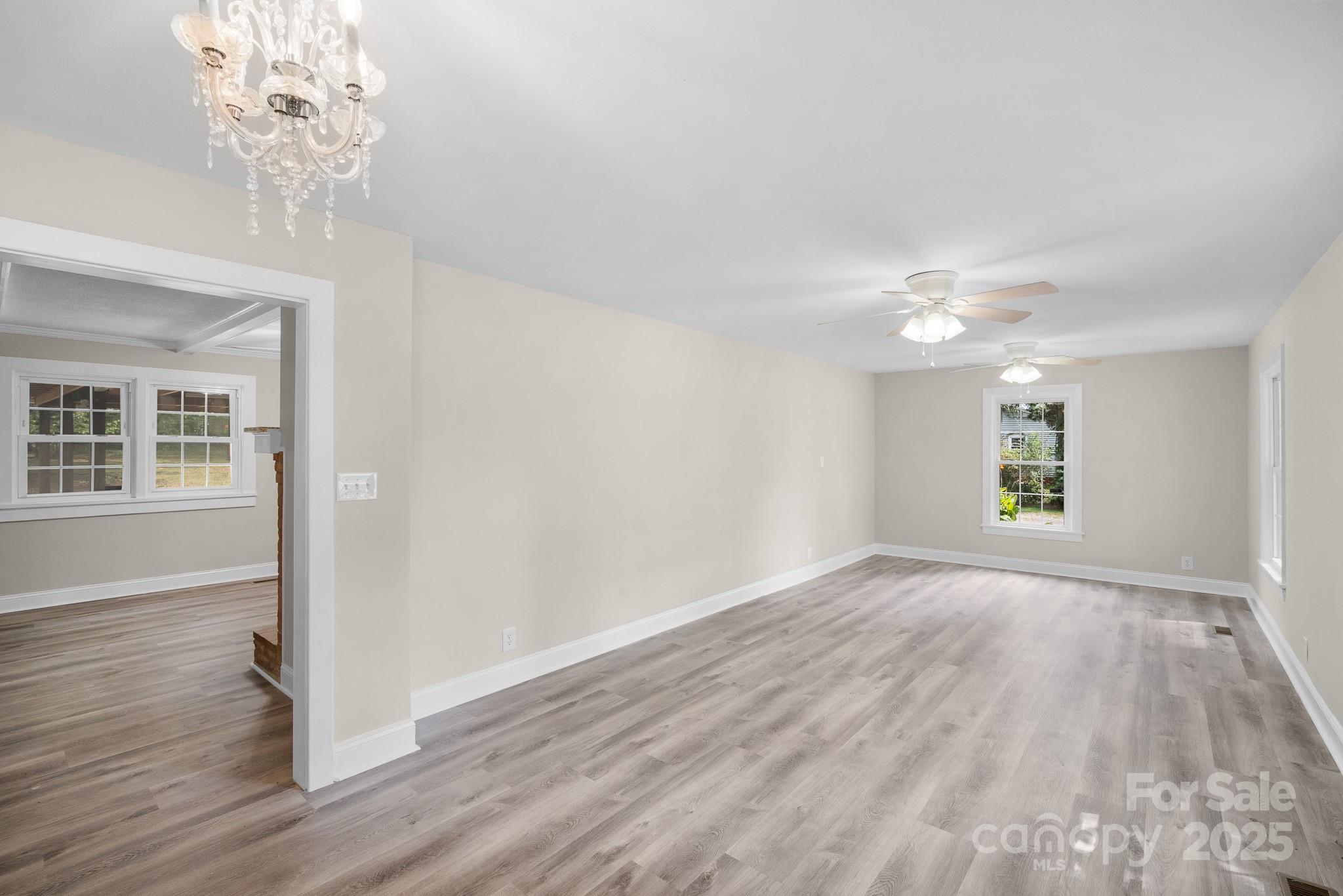 4355 Franklin Community Center Road Salisbury, NC 28144 - Photo 11 of 28 wooden floor in an empty room with a window