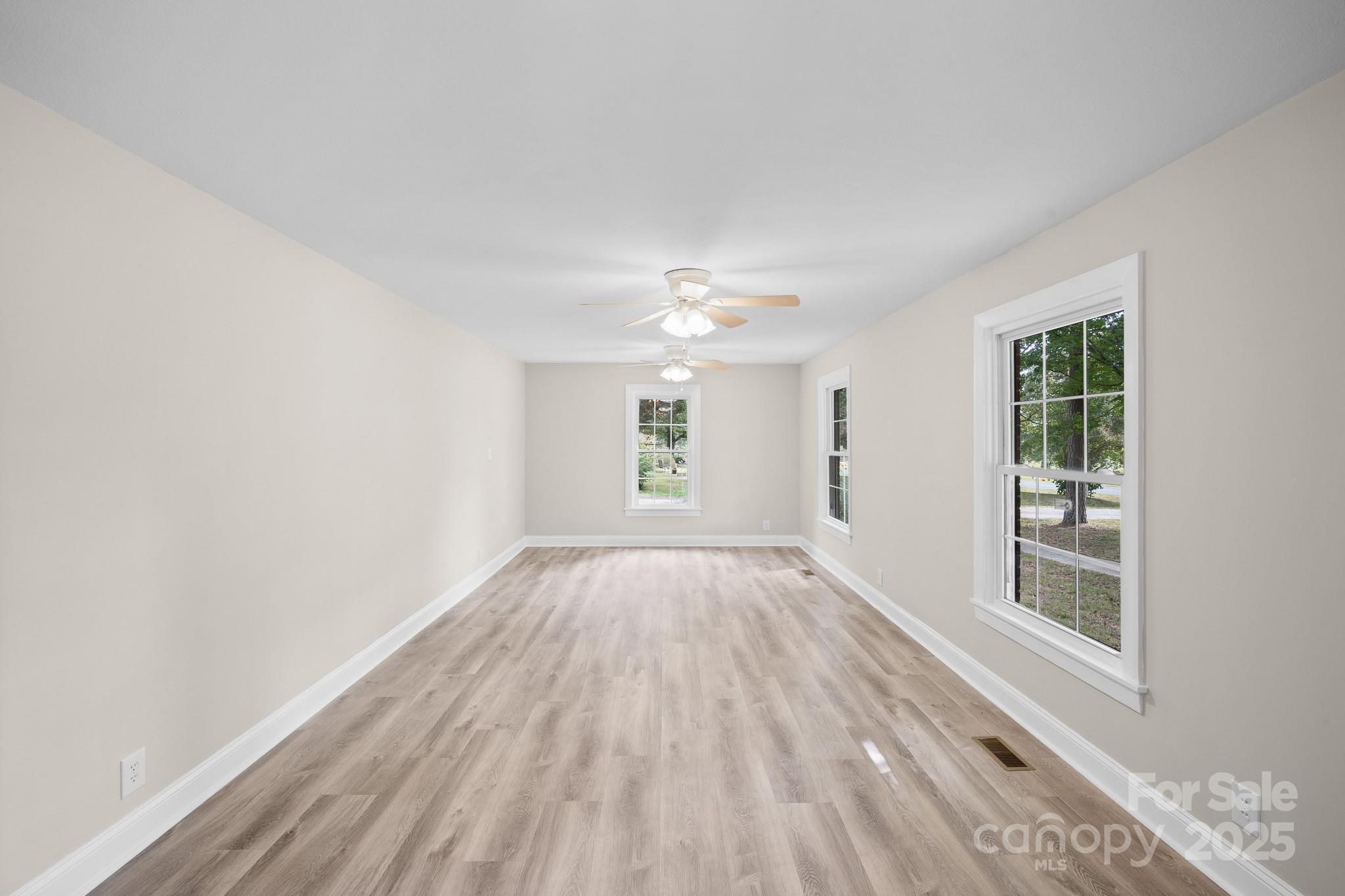 4355 Franklin Community Center Road Salisbury, NC 28144 - Photo 12 of 28 a view of an empty room with a window and wooden floor