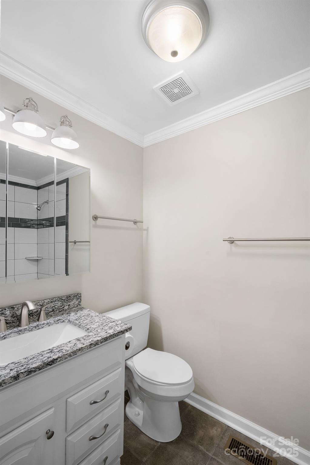 4355 Franklin Community Center Road Salisbury, NC 28144 - Photo 17 of 28 a bathroom with a granite countertop sink a toilet and a mirror