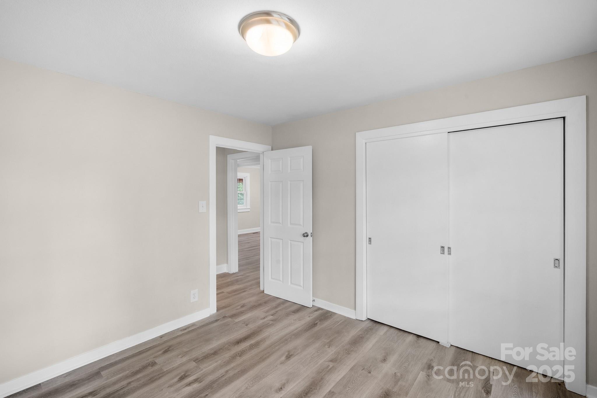 4355 Franklin Community Center Road Salisbury, NC 28144 - Photo 18 of 28 a view of an empty room with wooden floor