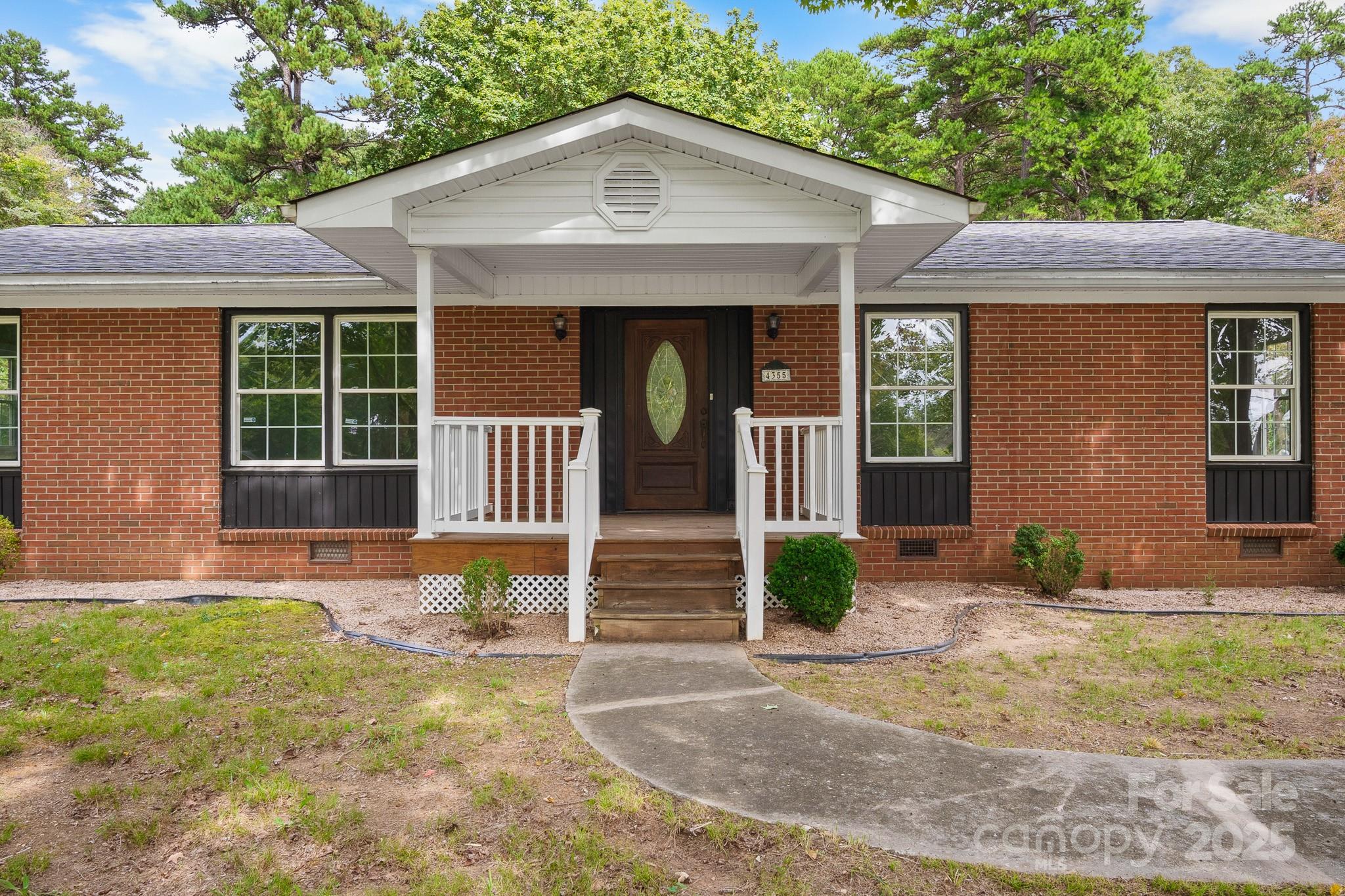 4355 Franklin Community Center Road Salisbury, NC 28144 - Photo 2 of 28 a front view of a house with garden