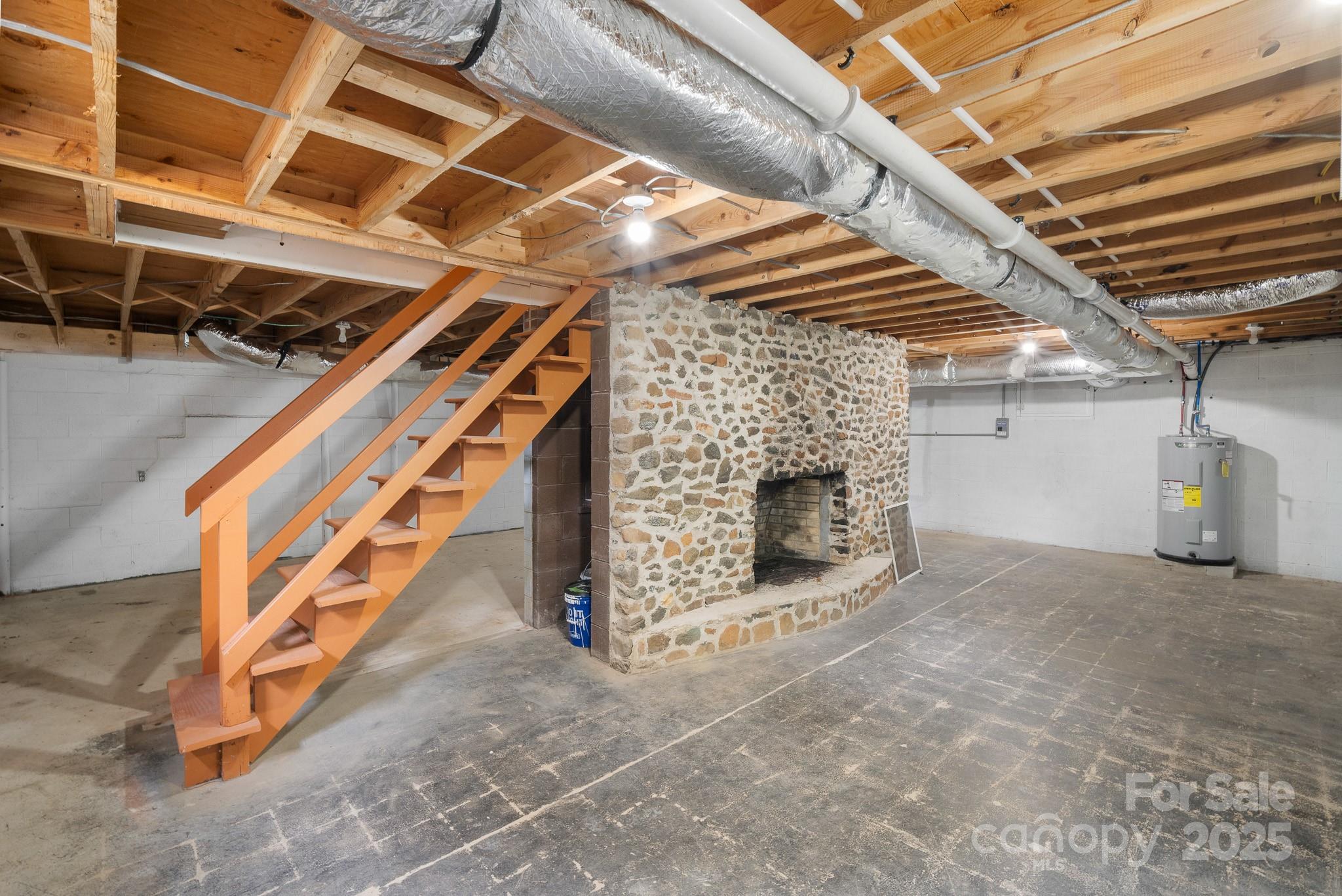 4355 Franklin Community Center Road Salisbury, NC 28144 - Photo 21 of 28 a view of an empty room with wooden floor and staircase
