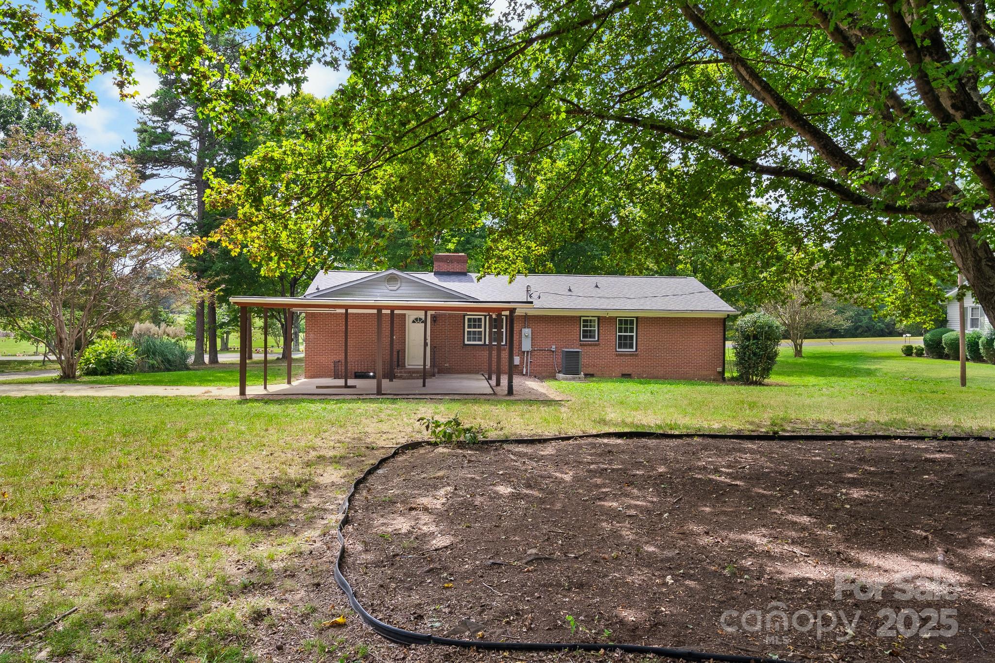 4355 Franklin Community Center Road Salisbury, NC 28144 - Photo 3 of 28 a view of a house with a backyard