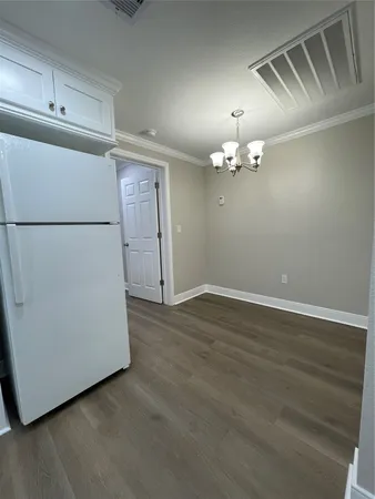 an empty room with wooden floor