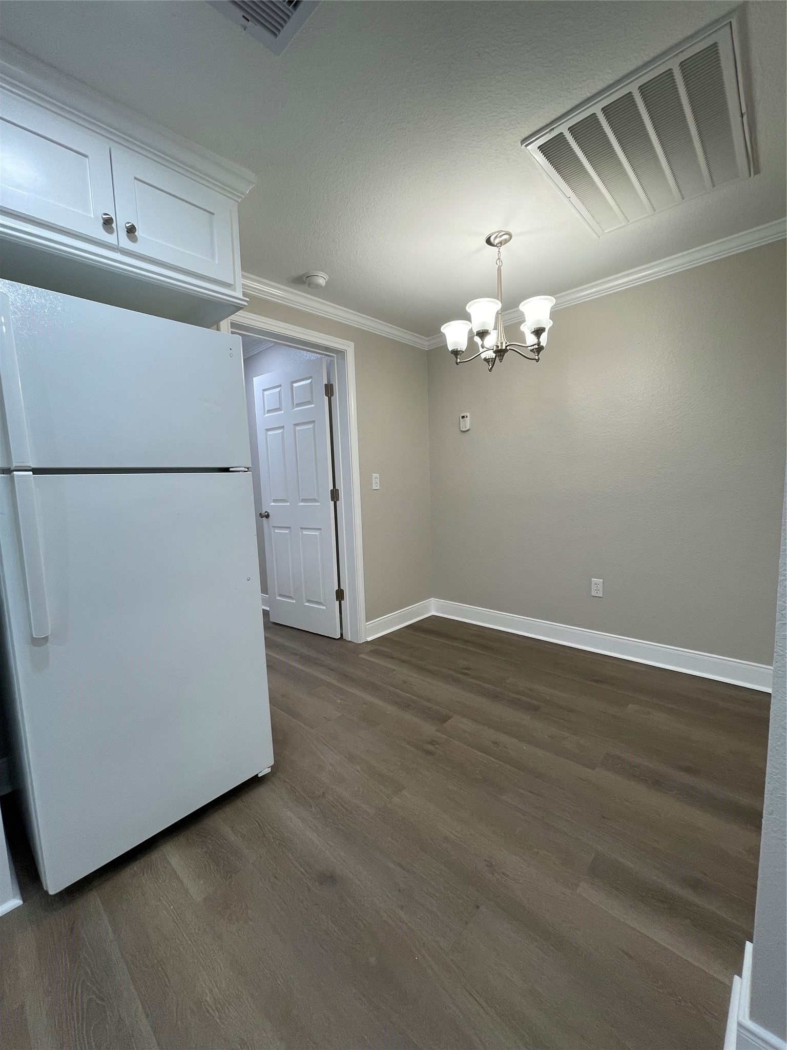 309 Ryan Street Angleton, TX 77515 - Photo 14 of 28 an empty room with wooden floor