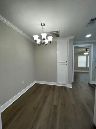 a view of livingroom with hardwood floor and kitchen view