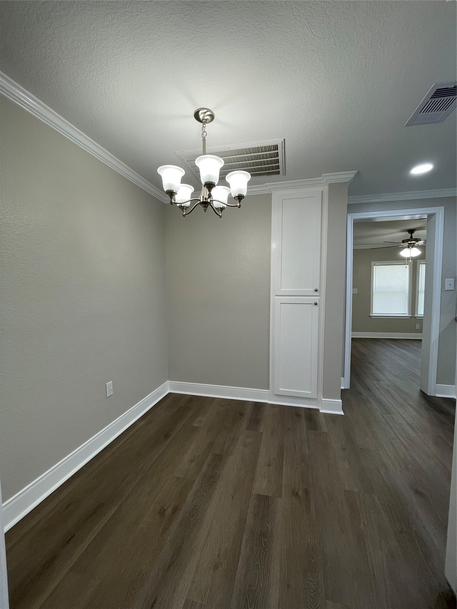 309 Ryan Street Angleton, TX 77515 - Photo 16 of 28 a view of livingroom with hardwood floor and kitchen view