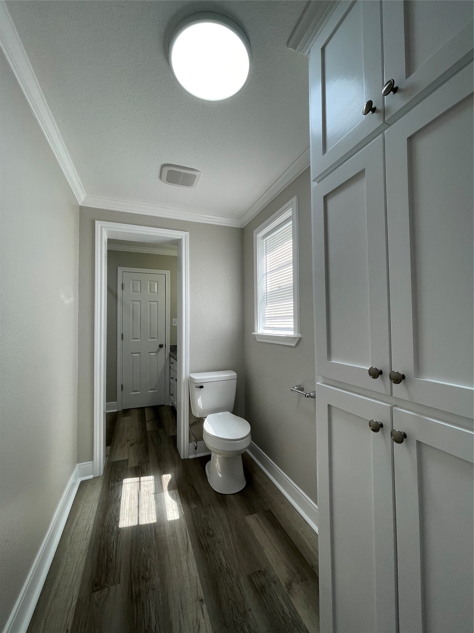 309 Ryan Street Angleton, TX 77515 - Photo 20 of 28 a bathroom with a toilet sink a mirror and vanity