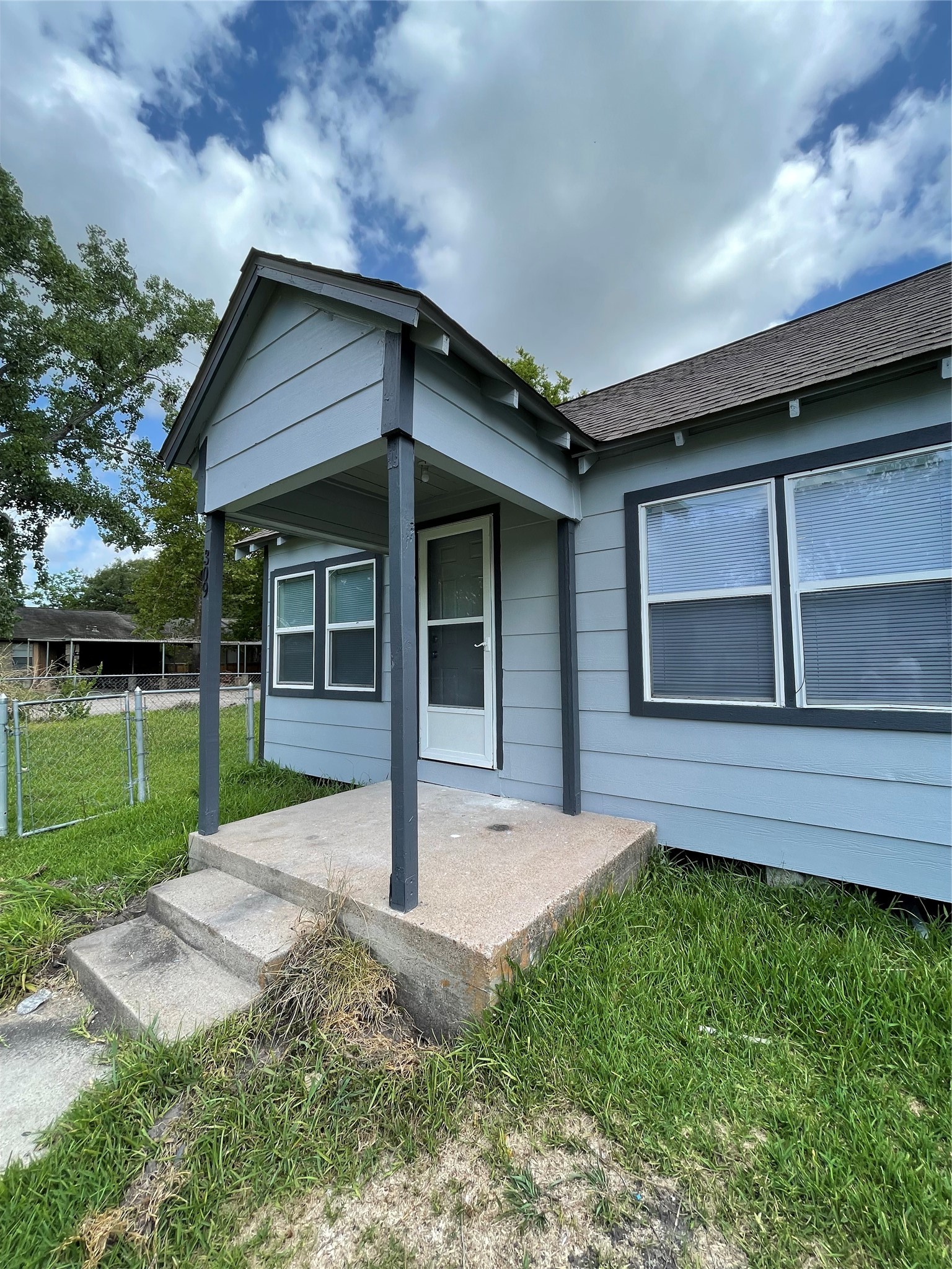 309 Ryan Street Angleton, TX 77515 - Photo 2 of 28 a front view of a house with a yard