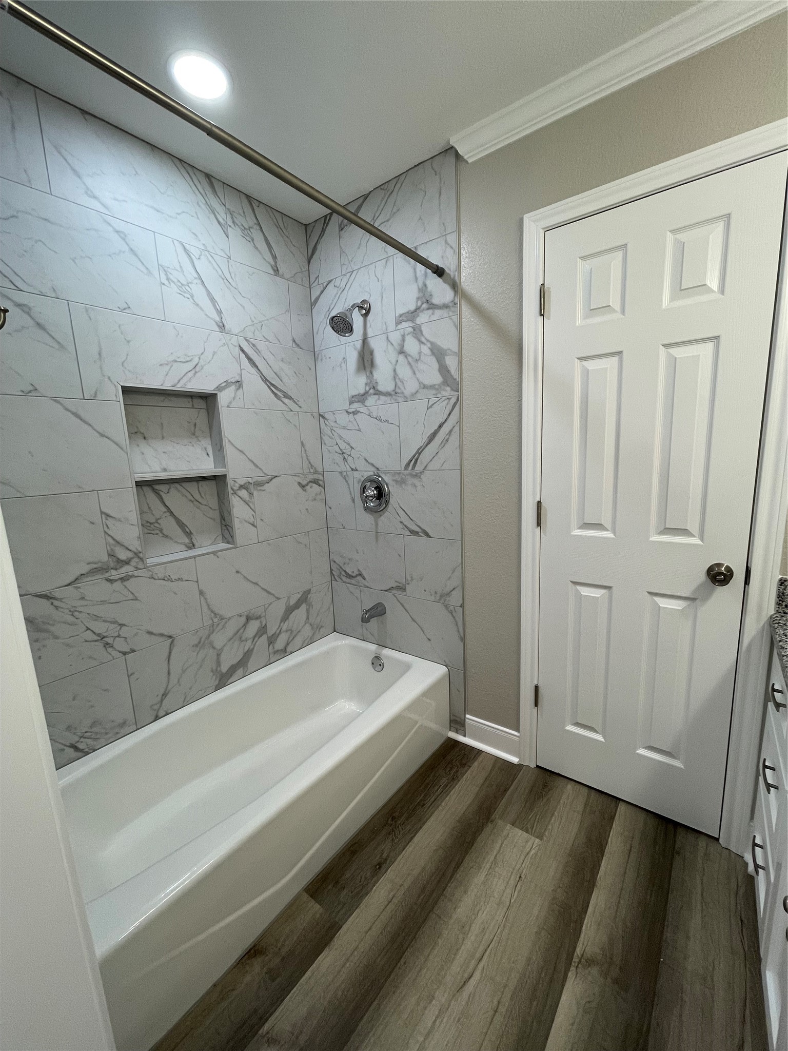 309 Ryan Street Angleton, TX 77515 - Photo 23 of 28 a bathroom with a bathtub and a shower