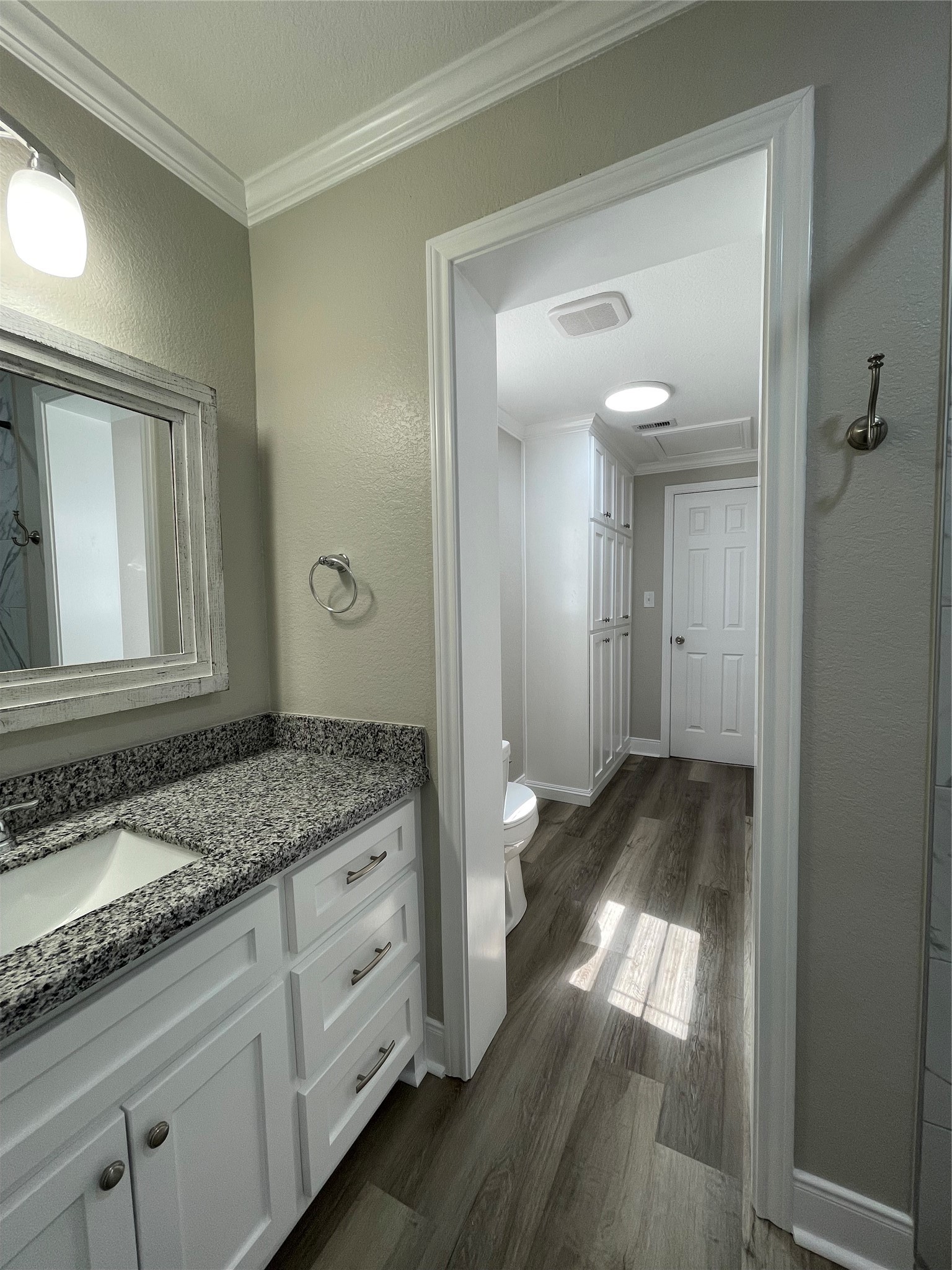 309 Ryan Street Angleton, TX 77515 - Photo 25 of 28 a bathroom with a granite countertop sink and a mirror