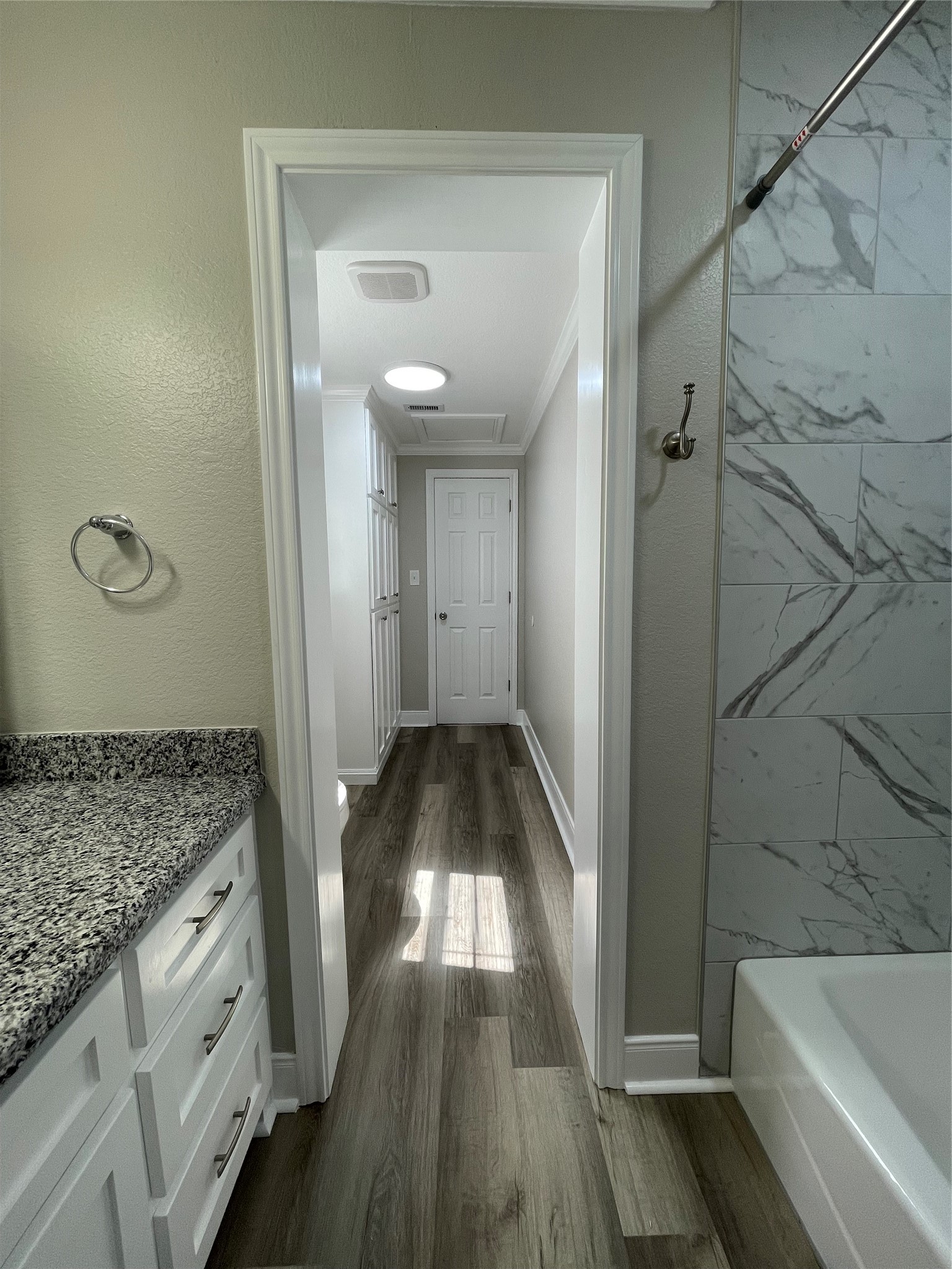 309 Ryan Street Angleton, TX 77515 - Photo 26 of 28 a bathroom with a granite countertop sink a toilet and shower