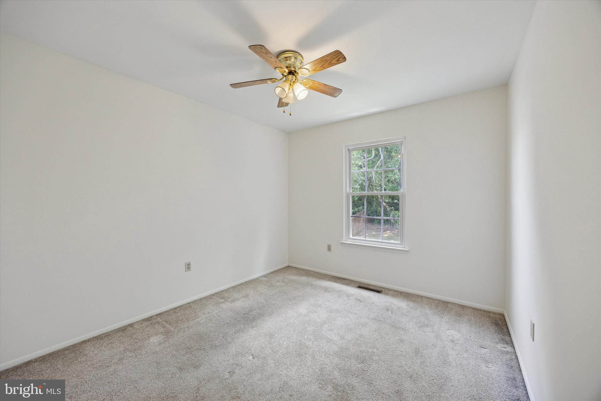 27 Iris Lane Newark, DE 19702 - Photo 18 of 31 an empty room with window and ceiling fan