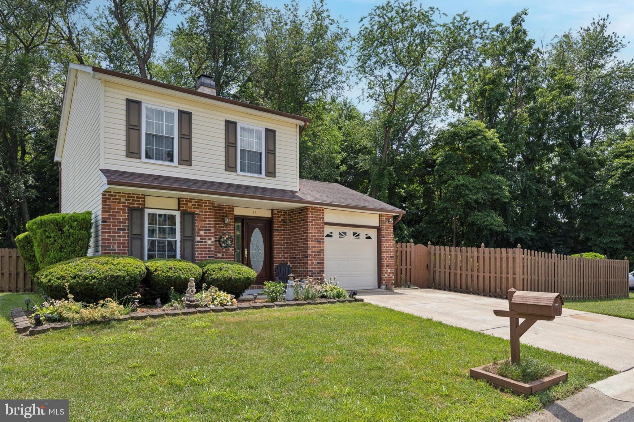 27 Iris Lane Newark, DE 19702 - Photo 2 of 31 a front view of a house with garden and plants
