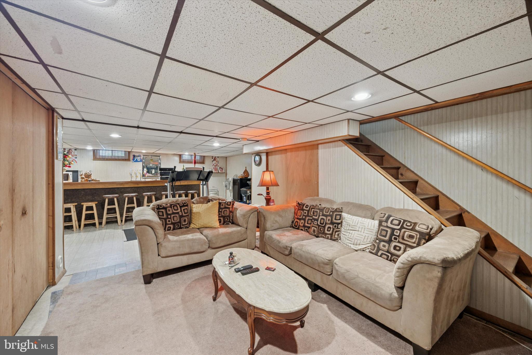 27 Iris Lane Newark, DE 19702 - Photo 24 of 31 a living room with furniture and a chandelier
