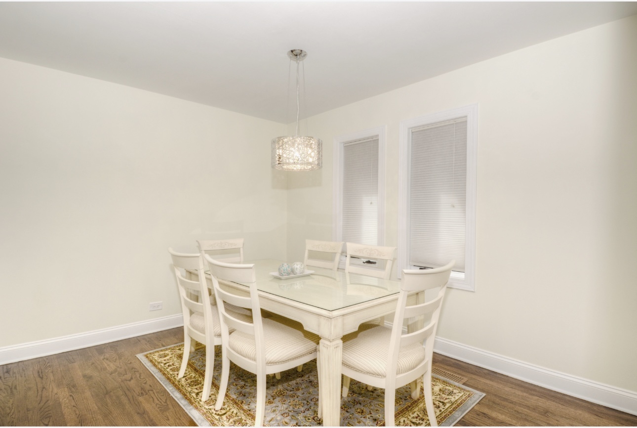 1115 Harms Road Glenview, IL 60025 - Photo 13 of 34 a view of a dining room with furniture and wooden floor